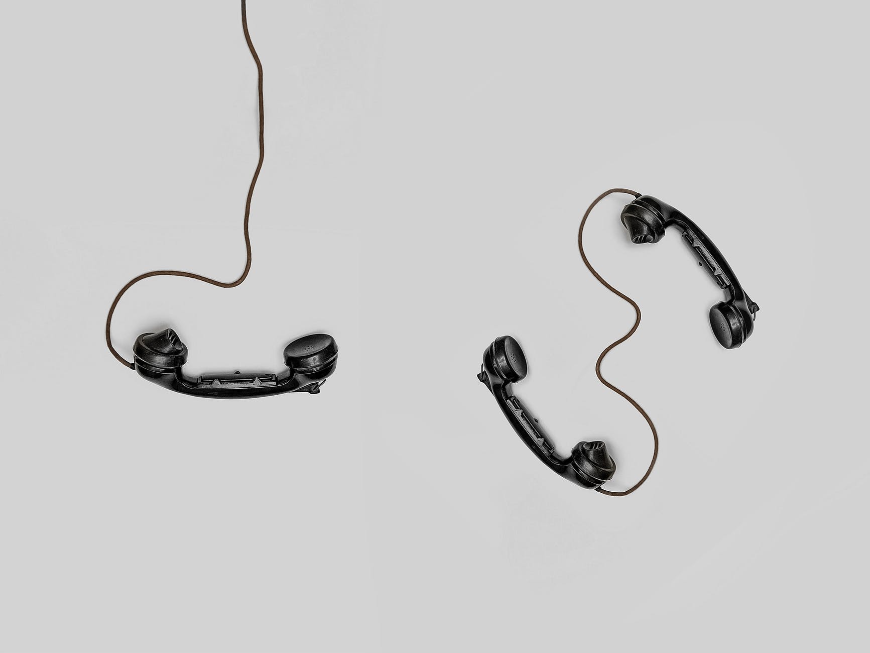 three black handset toys