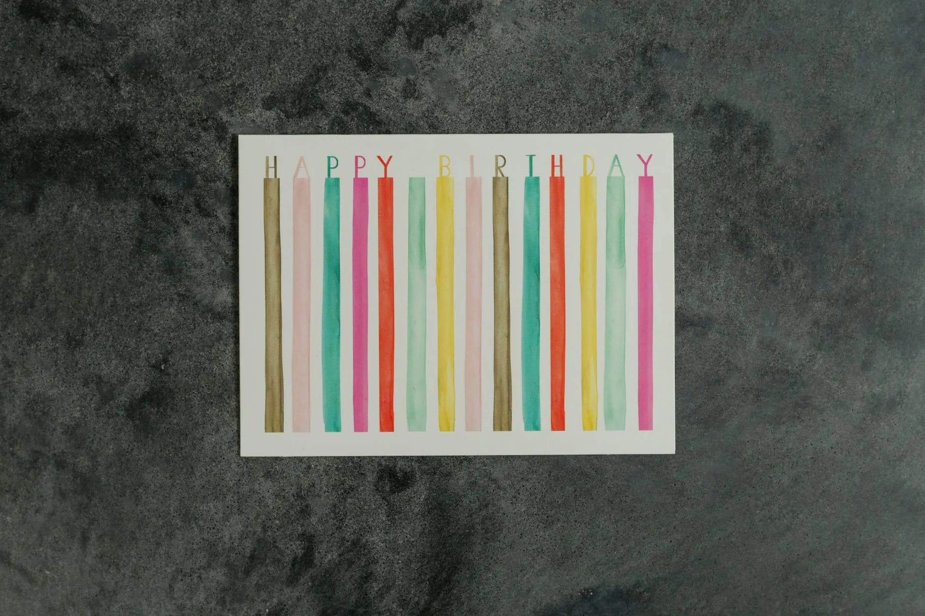 colorful happy birthday greeting card on dark background