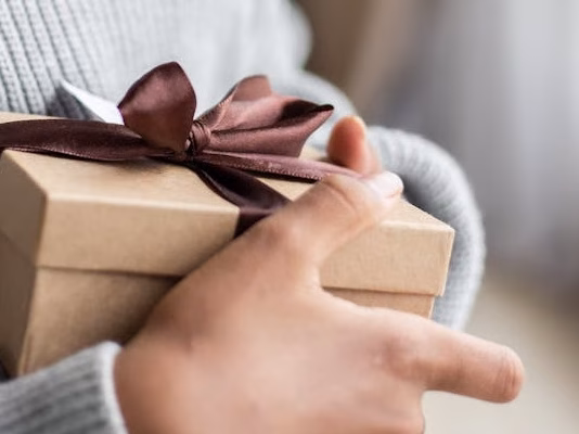crop black girl with gift box
